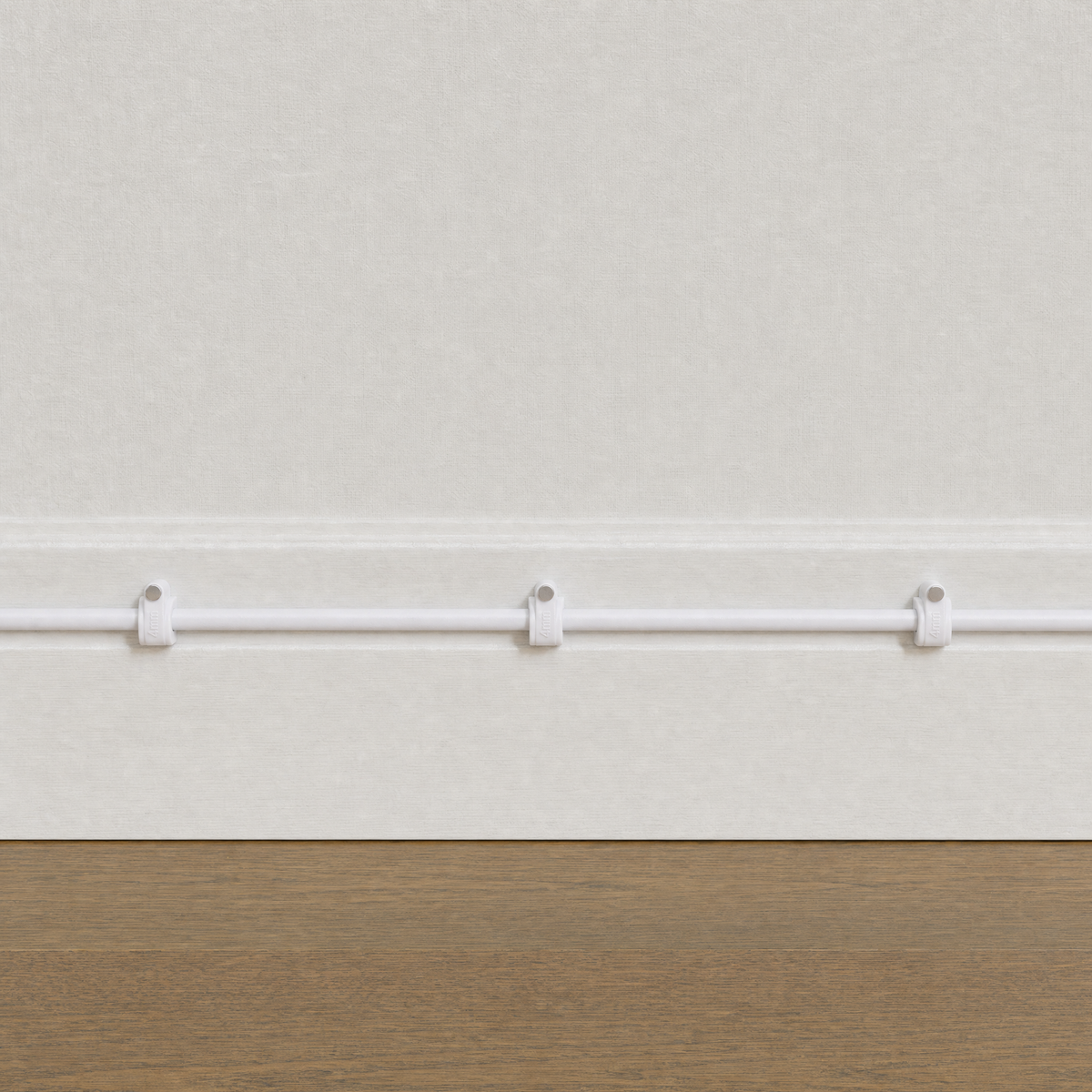 QualGear 4 mm cable clip in white mounted along a light wall, cable run framed to the wall only