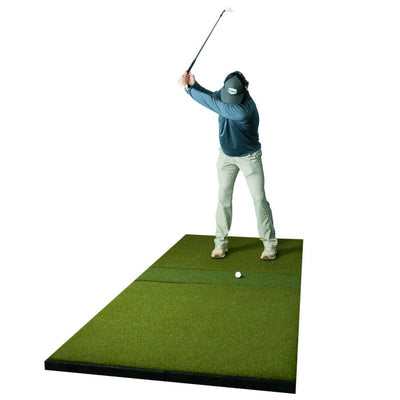 Golfer swinging on a SIGPRO golf mat