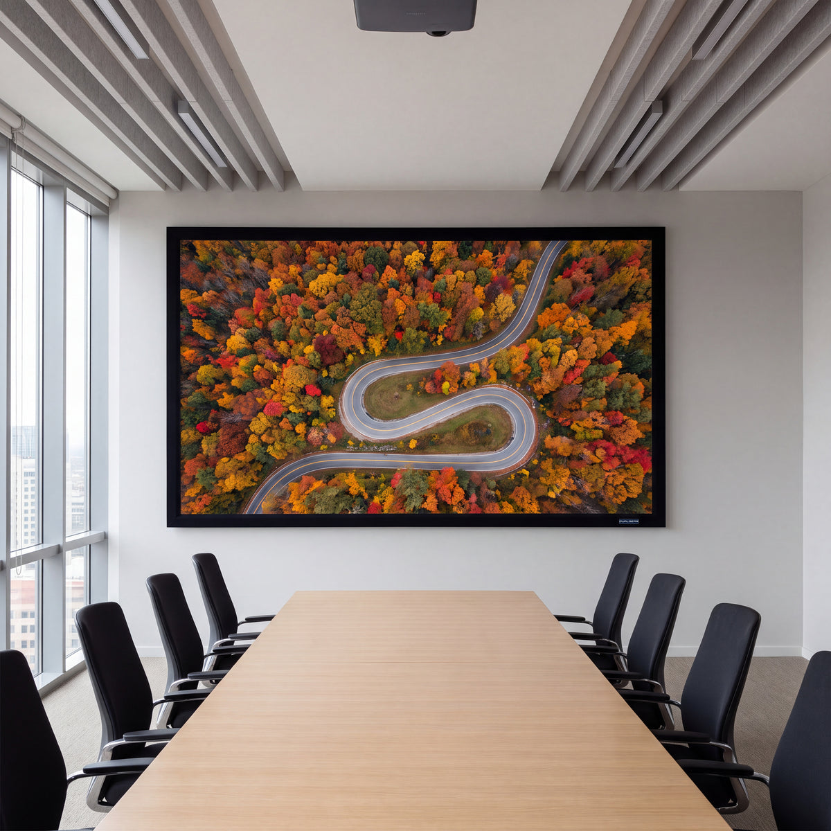 QualGear 110-inch 16:9 fixed frame projector screen, high contrast gray 0.9 gain surface, wall-mounted and in use with a projected image.