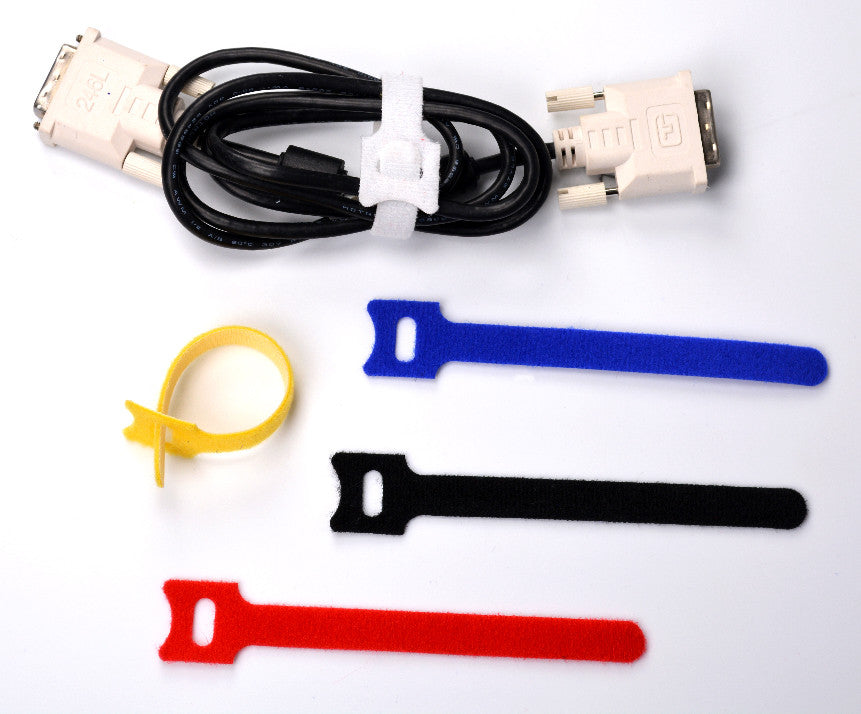 Coiled video cable secured with a white QualGear hook-and-loop tie, with four more colors beside it