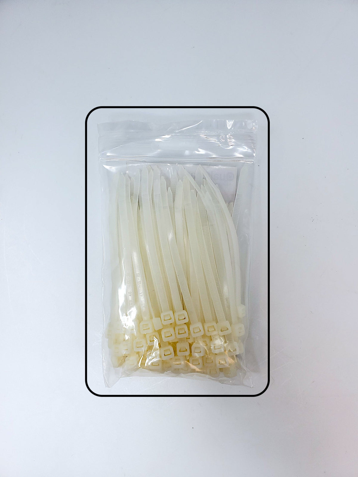 Sealed 100-pack bag of white 4 in self-locking cable ties
